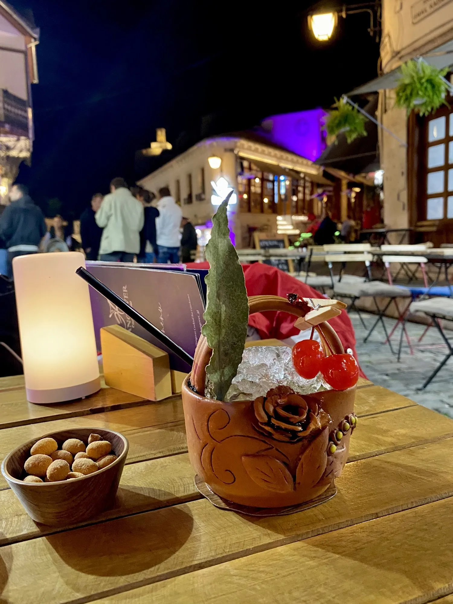 The terrace at night, with the old bazaar and the lit castle behind
