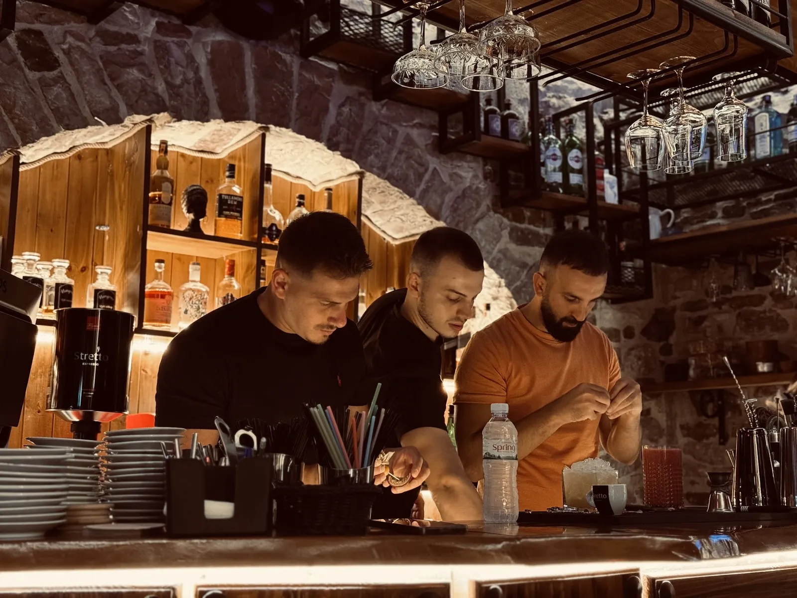 Three Hangover bartenders preparing drinks behind the bar